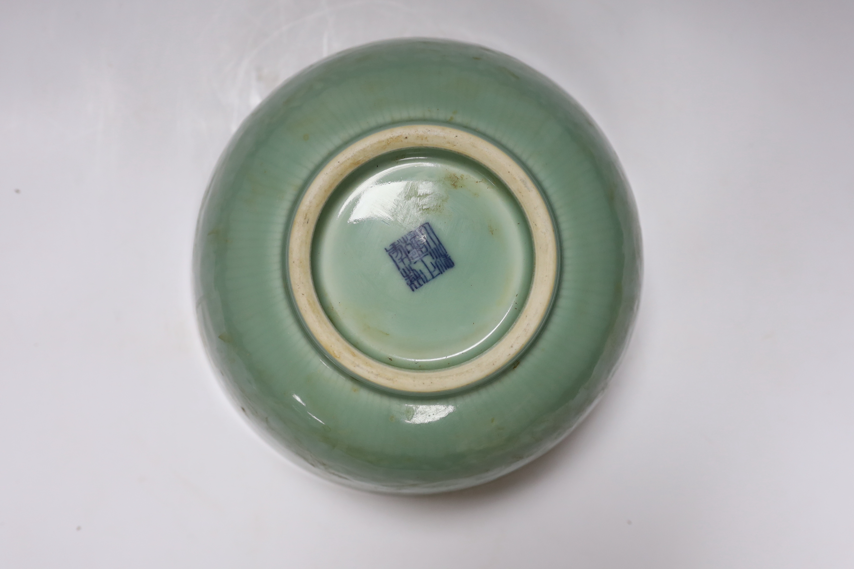 A Chinese celadon glazed ‘lotus’ bowl, 25cm diameter